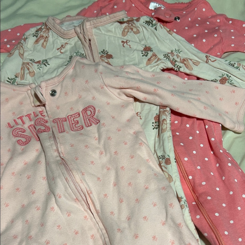 Angel Dear, Gerber, and Carter Pink and Cream babies sleepers.